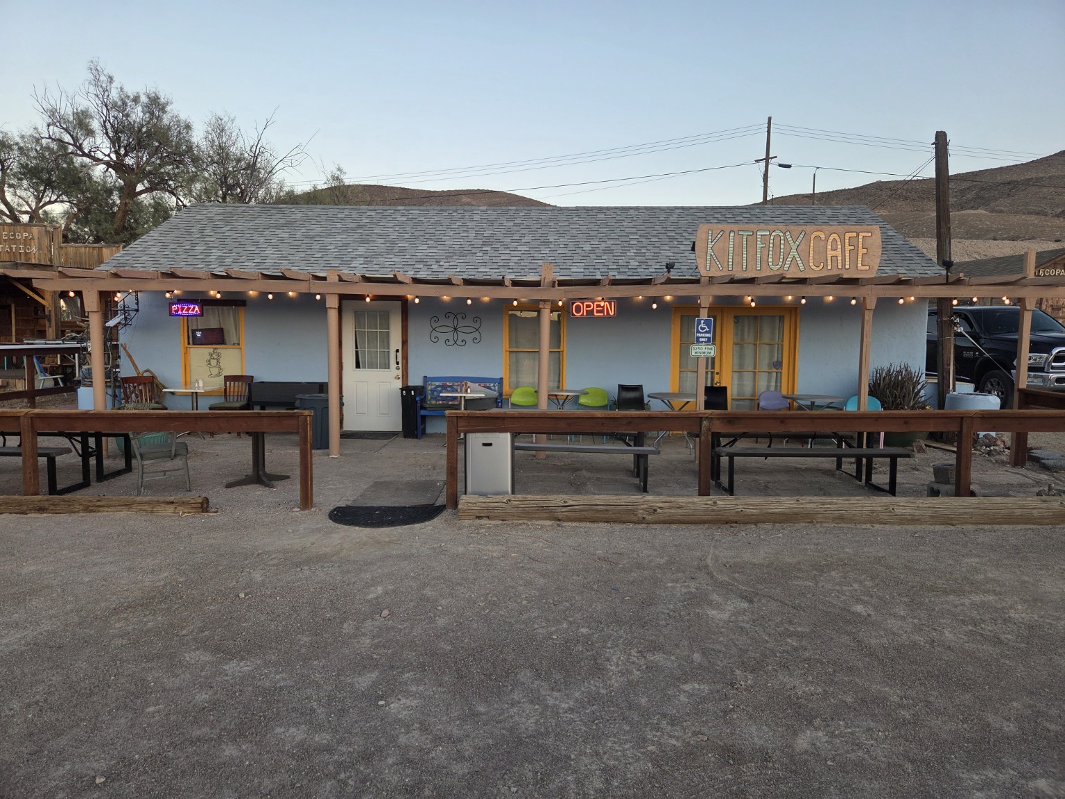 Kit Fox Cafe exterior with patio and open sign
